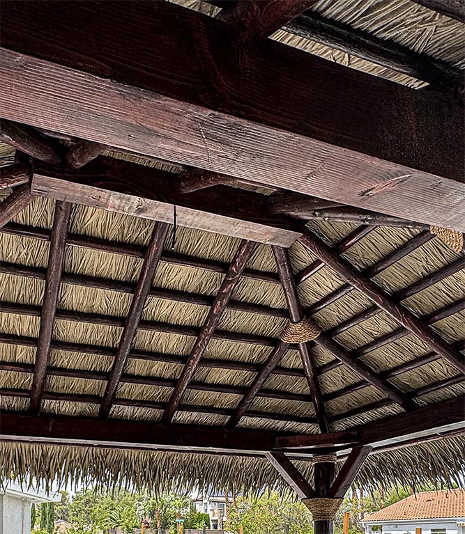 nipa thatch installed on open batten palapa